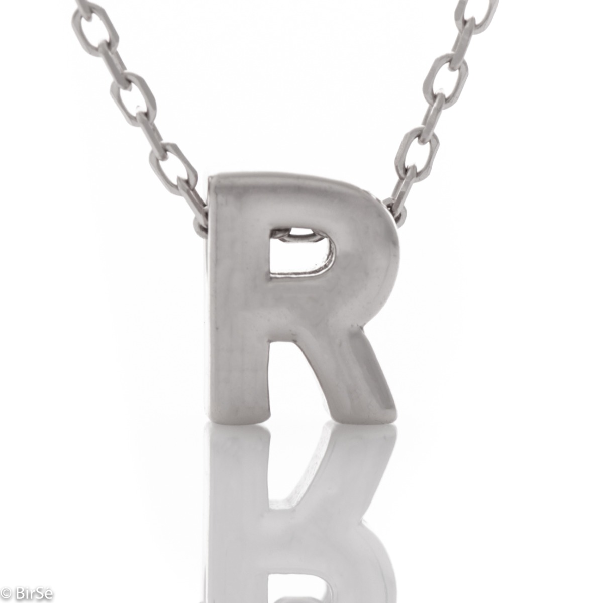 A simple necklace made of shiny rhodium silver with a beautiful letter R. The necklace is suitable for everyday wear in combination with various silver jewelry.