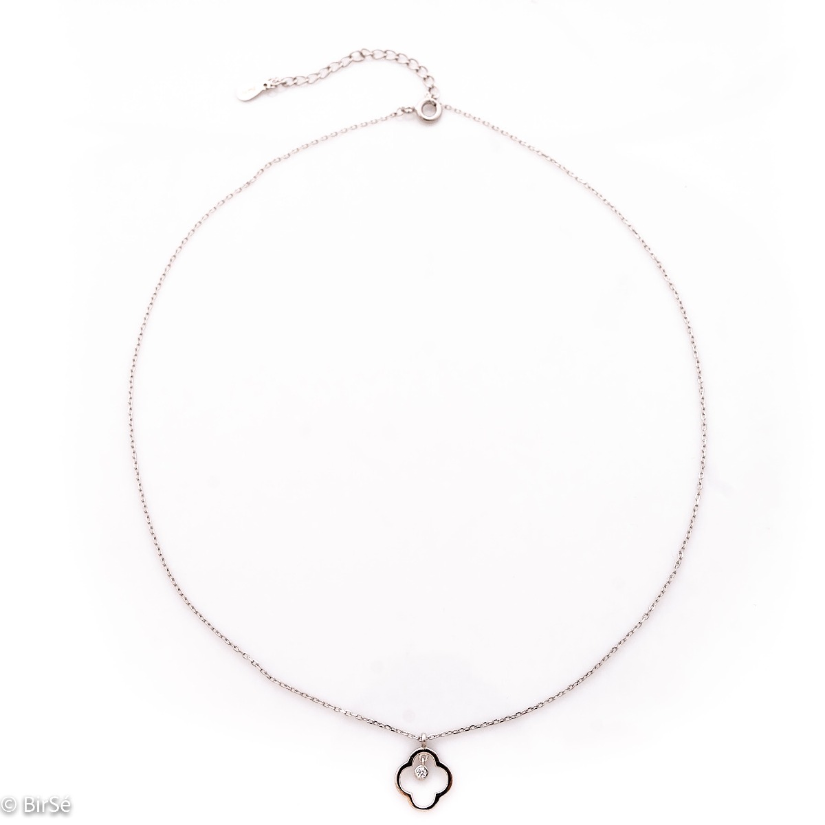 Finely crafted classic sterling silver necklace with a delicate clover outline. Elegantly dangling zircon adds extra sparkle to the necklace.