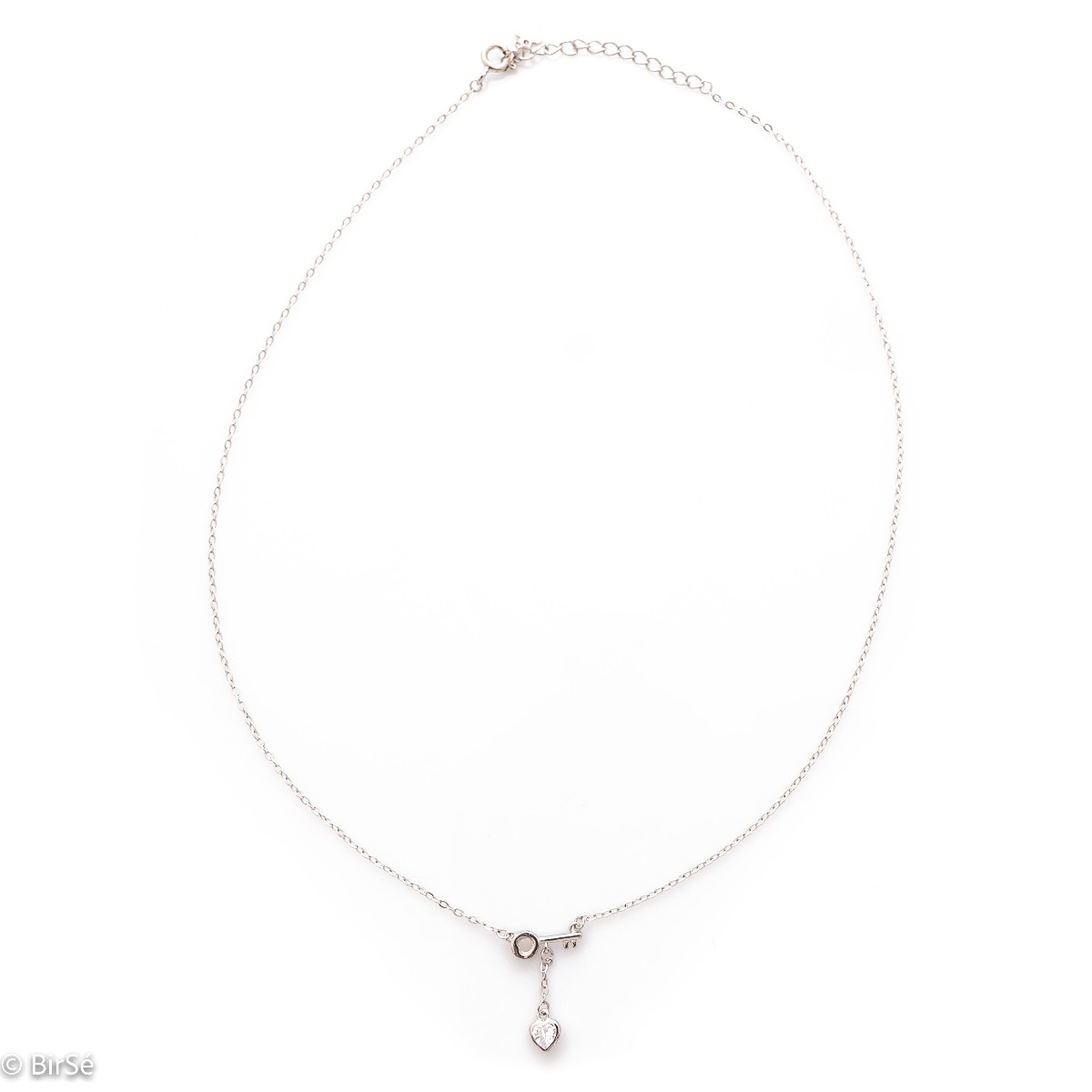 Elegant silver message necklace. A dainty rhodium-plated chain is attached to a dainty key with a cubic zirconia heart hanging below. Discover the key to the heart of the beloved woman with the charming necklace from BirSe.