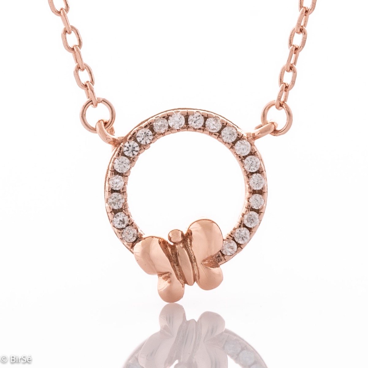 A lovely necklace in soft rose silver, with an elegantly shaped circle, all studded with sparkling zircons. A small, delicate butterfly is perched timidly on the stones. The necklace is an ideal gift to please a friend or beloved woman.