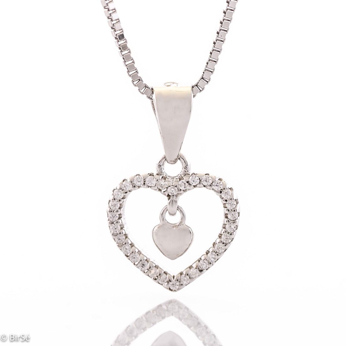 A classic rhodium silver necklace that will gently adorn your neck. The pendant is in the shape of a heart, all studded with zircons.