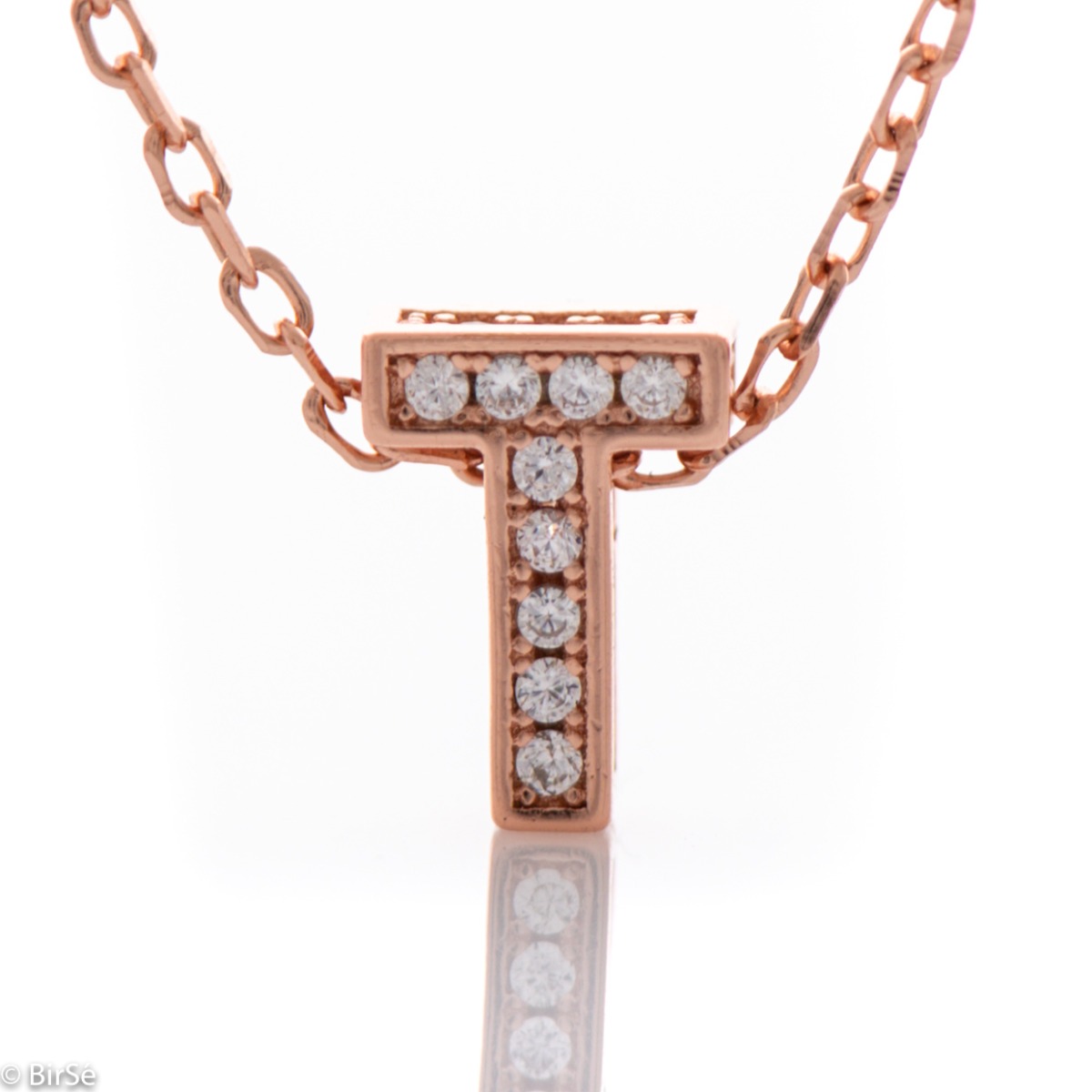 Finely crafted rose silver letter T necklace for women, all encrusted with glittering zircons. An attractive piece of jewelry in which the delicate beauty of rose silver is skilfully combined with the brilliance of zircons.