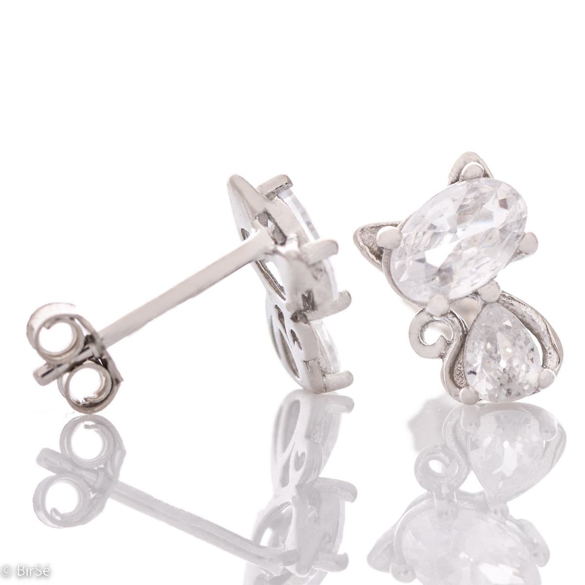 Captivating sterling silver earrings with a charming design of soft silver delicately shaping a kitten figure. The added sparkling zircons only enhance the beauty of the jewelry. Complete with a pendant of the same design.