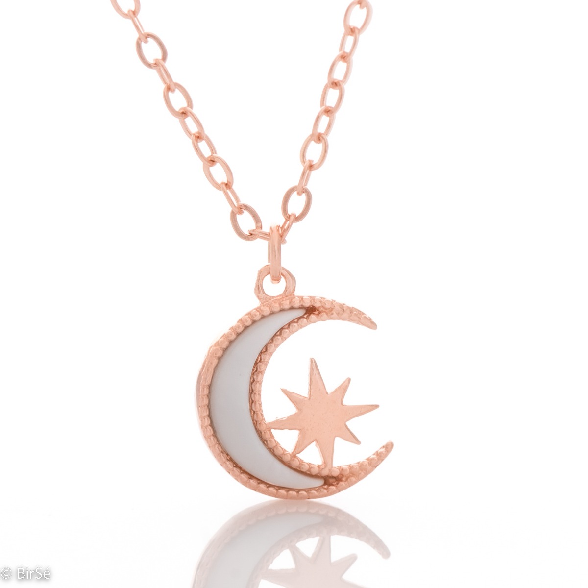 Elegant women's necklace with an exquisite design in rose silver. The jewelry is of unique craftsmanship - a gentle moon, charmingly shining in the company of a glittering star.