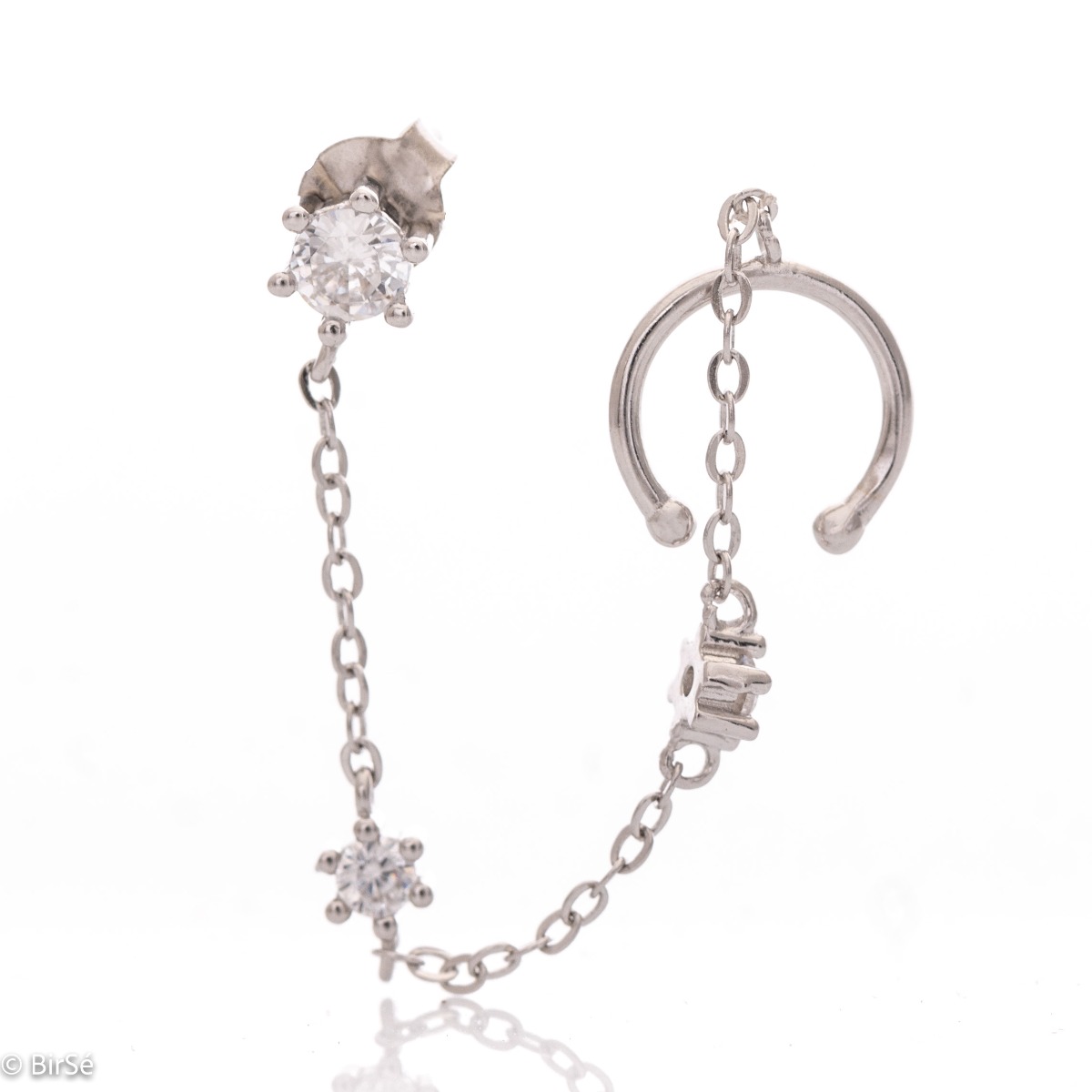 Tempting earring, with precise craftsmanship and extremely impressive pattern, decorated with dazzling zircons on a fine chain of shiny rhodium silver. The extravagant earring can be combined with matching single stone models or as a second earring.