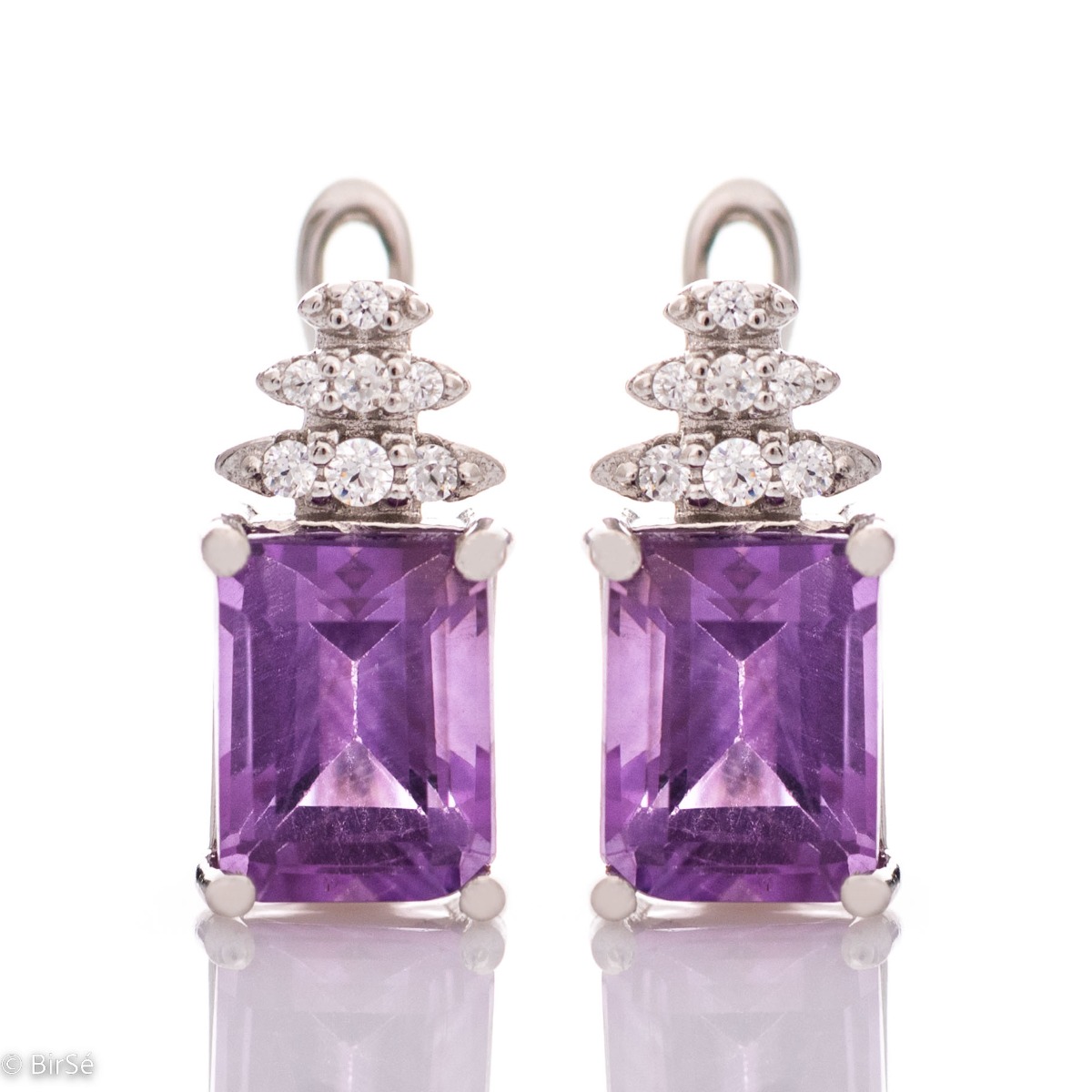 A fairy tale magic – delicate earrings made of rhodium silver with an English clasp. A combination of natural amethyst baguette and zircons in an elegant design.