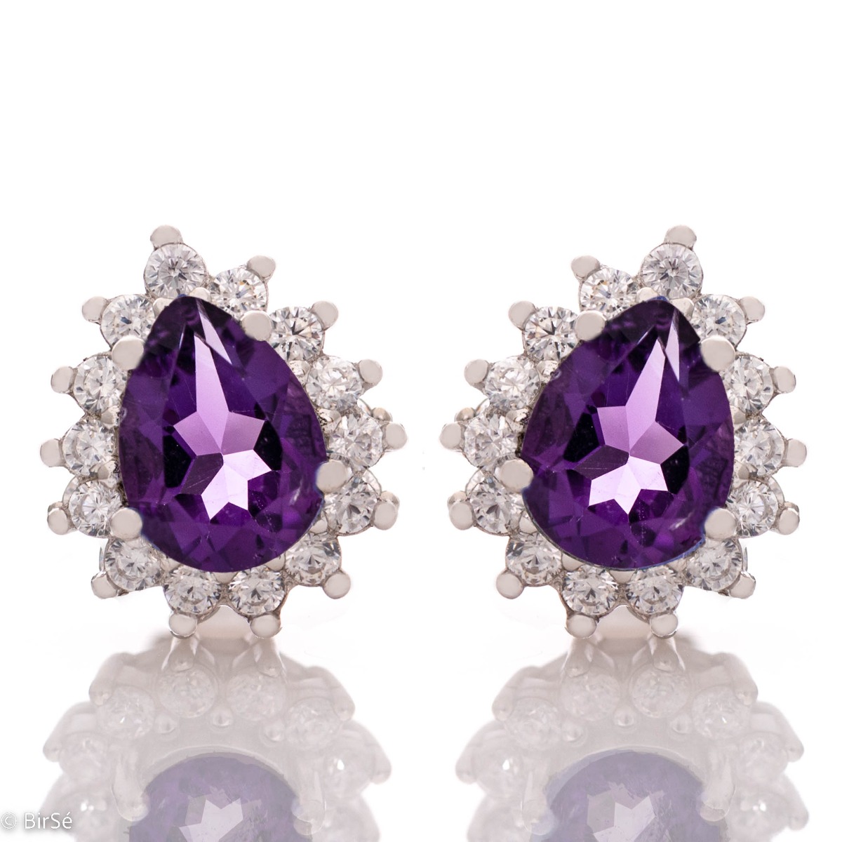 Elegant women's stud earrings with delicate drop-shaped natural amethyst surrounded by sparkling zircons and exquisitely crafted in beautiful rhodium silver. In a charming ring and pendant set.