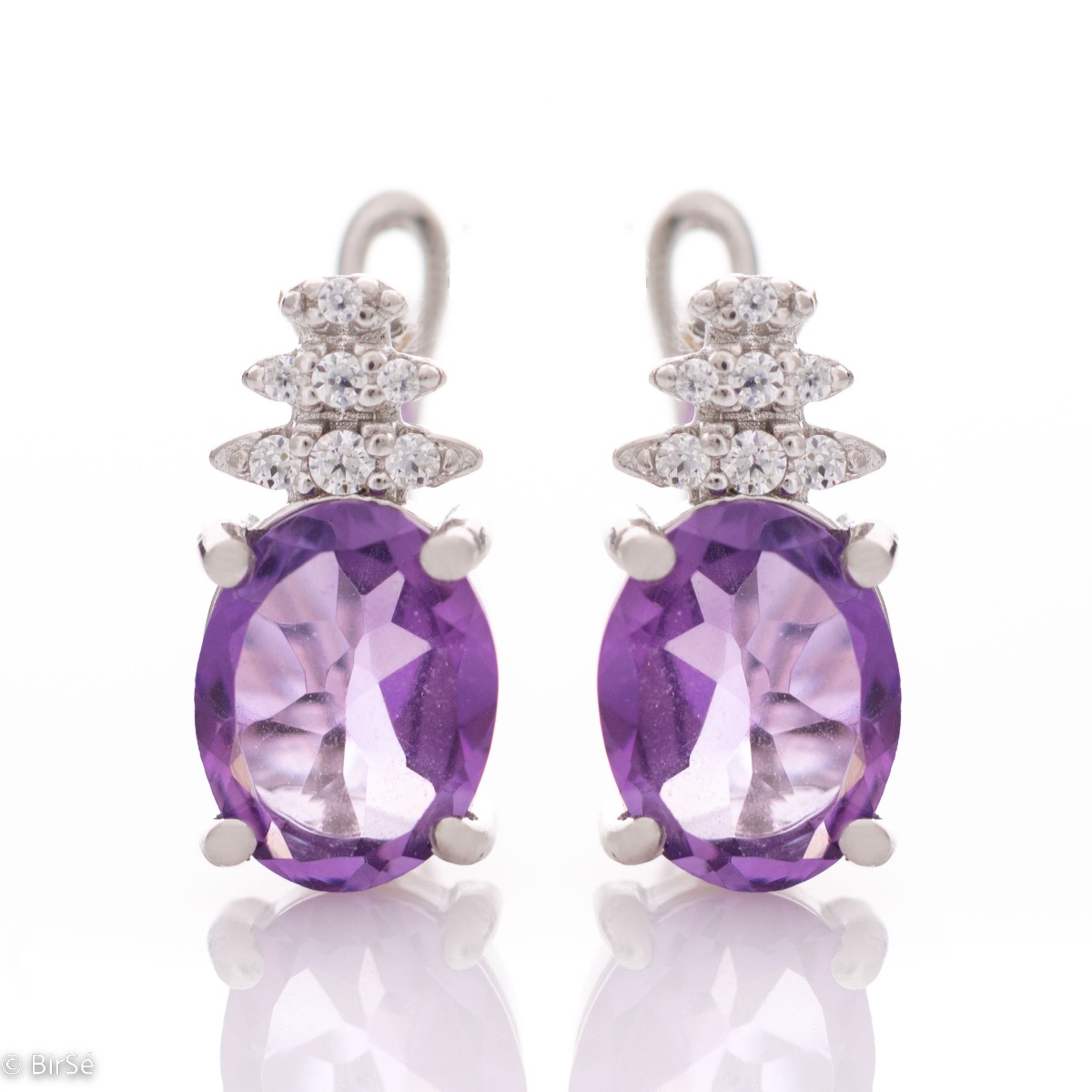 Exquisite ladies' English clasp earrings delicately crafted entirely from rhodium-plated silver, combined with captivating natural amethyst and sparkling zircons. They can be combined with a ring and pendant of the same model.