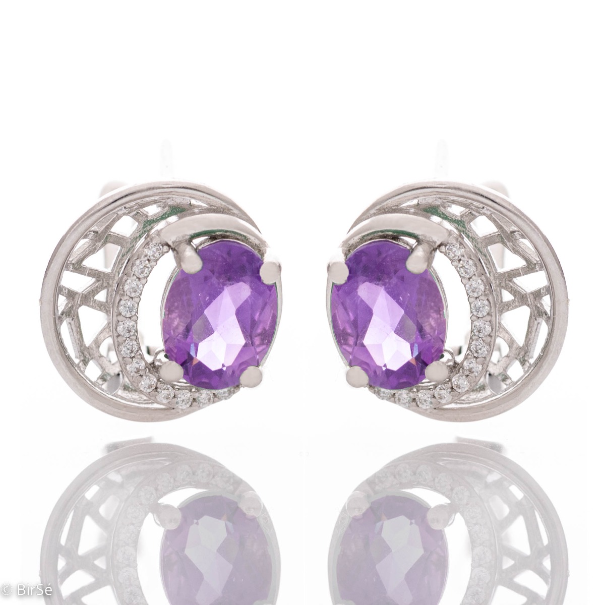 Elegant silver earrings with a modern look and English clasp. Stylish designer craftsmanship from a fine combination of rhodium-plated silver with captivating natural amethyst. Complete with silver pendant and silver ring from the same collection.