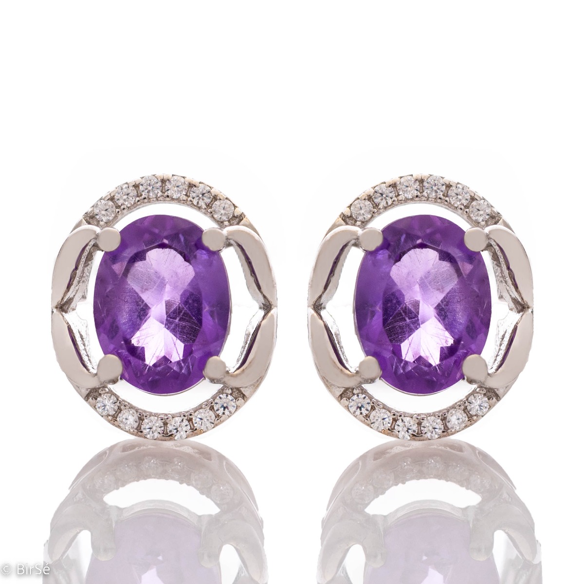 One word describes these earrings and that is 'beauty'. Made of rhodium-plated silver, the earrings successfully combine modern design and classic stones - amethyst and zircons.