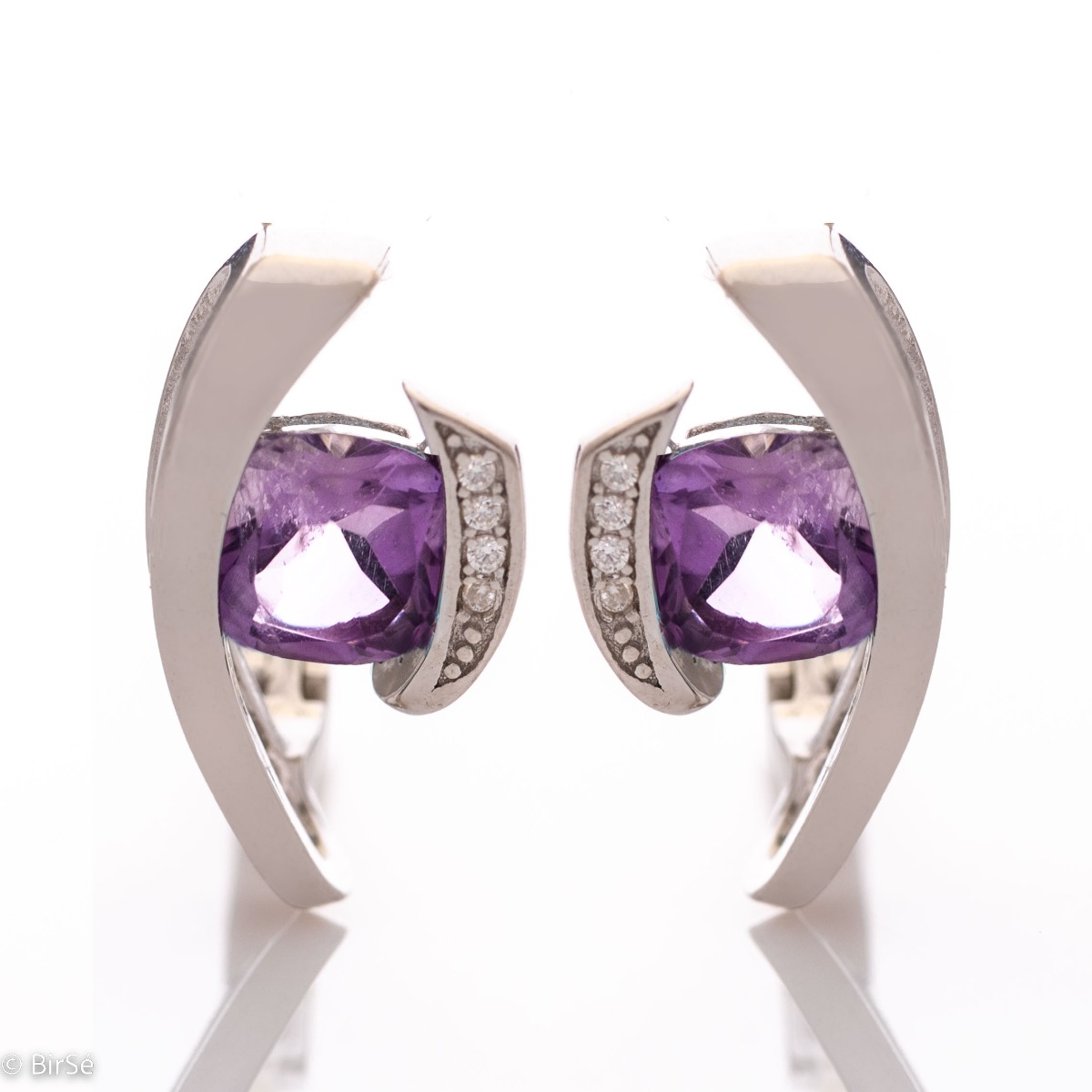 As an accent to your look, sometimes it's good to add a darker shade of natural stones. Add the beauty of natural amethyst in our rhodium silver English clasp earrings that come with a ring set.