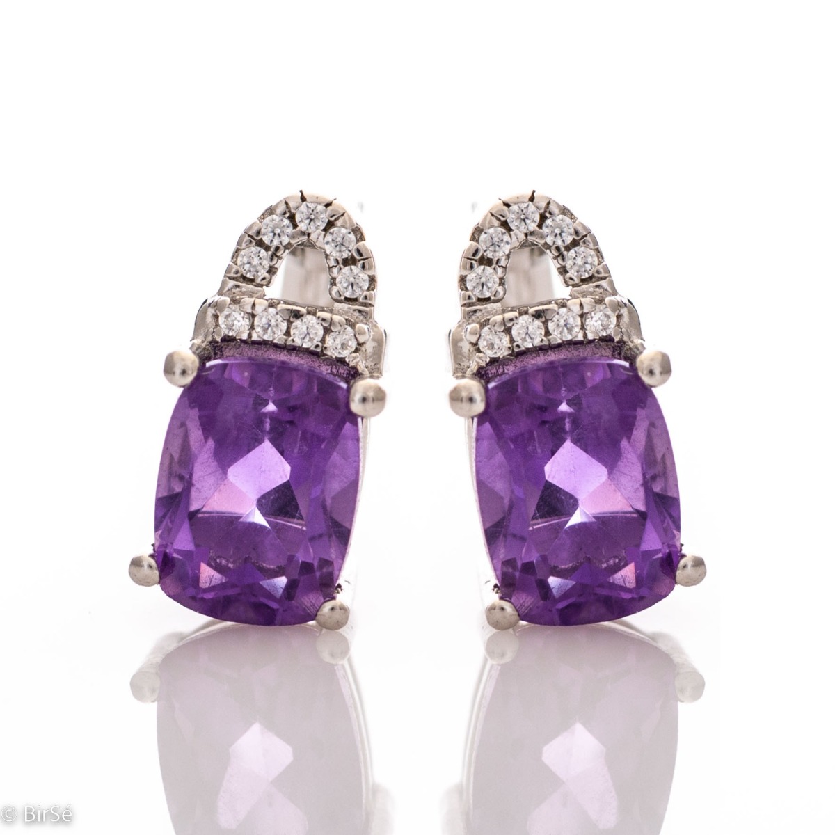 Elegant women's earrings with English clasp and precision craftsmanship entirely of rhodium-plated silver, combined with radiant natural amethyst and sparkling zircons. They can be combined with a ring and pendant of the same model.