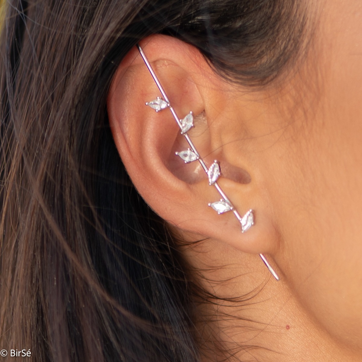 Eccentric women's earrings in fine rhodium silver, with an interesting design layout resembling a branch with leaves of zircons. The earrings are a hairpin type, with a piercing attachment. Extremely sexy style, a suitable gift for girls and women, fans o