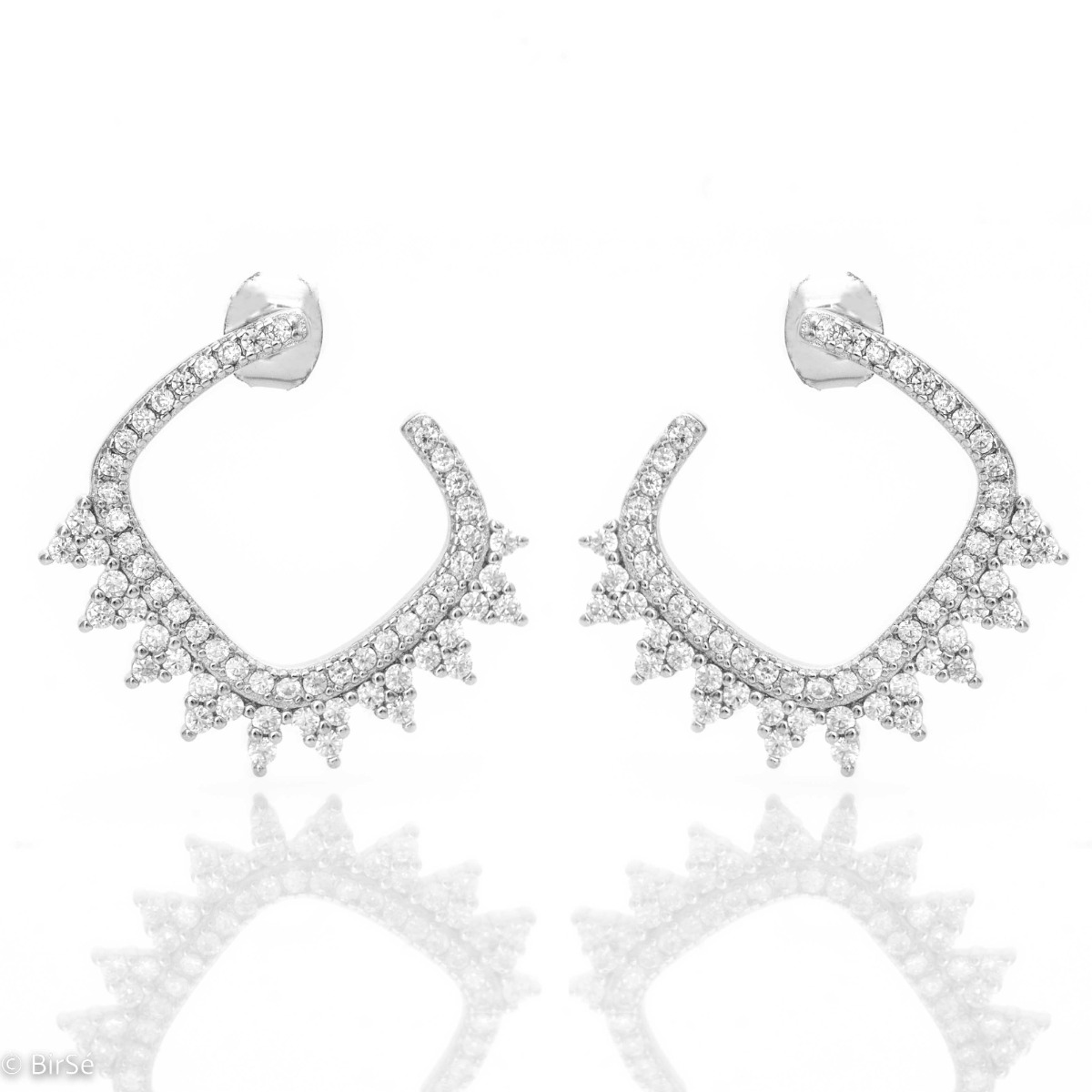 Tempting women's stud earrings, carefully crafted entirely from fine rhodium silver, forming an elegant pattern. Dazzling zircons adorning the earrings give them a gentle charm.