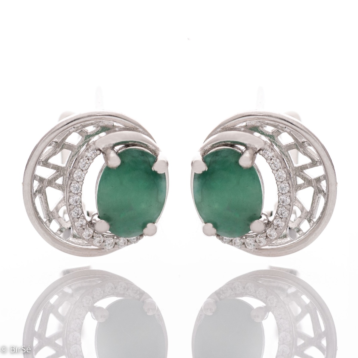 Elegant silver earrings with a modern look and English clasp. Stylish designer craftsmanship from a fine combination of rhodium-plated silver with captivating natural emeralds. Complete with silver pendant and silver ring from the same collection.