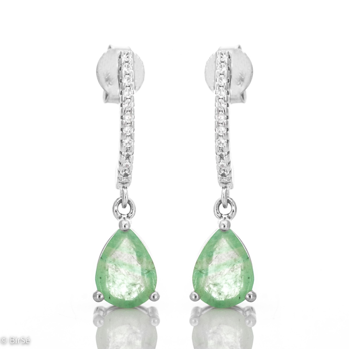 Add a dash of glamor to your earring choices with this stunning pair of rhodium silver and natural emerald. The earrings are dangling and will make your face even more shiny and charming.