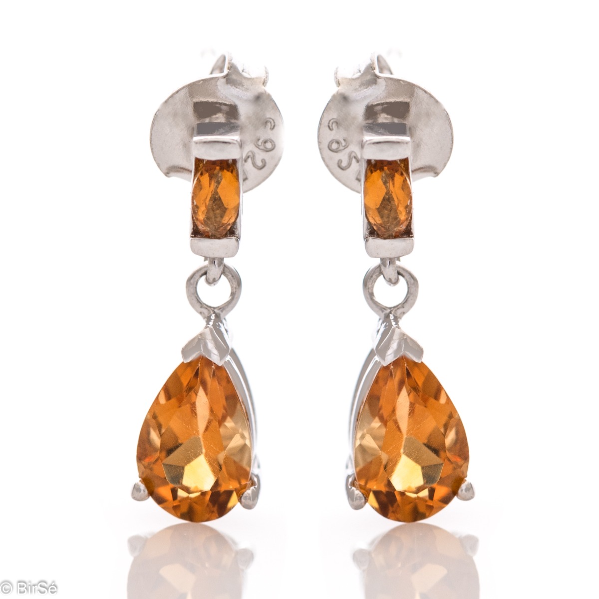 Delicately elegant silver earrings with a spectacular look and fastening with a pin. Stylish compositional design of the elements from a fine combination of rhodium-plated silver with a drop of golden citrine. Part of a set with a ring in the same gold lu