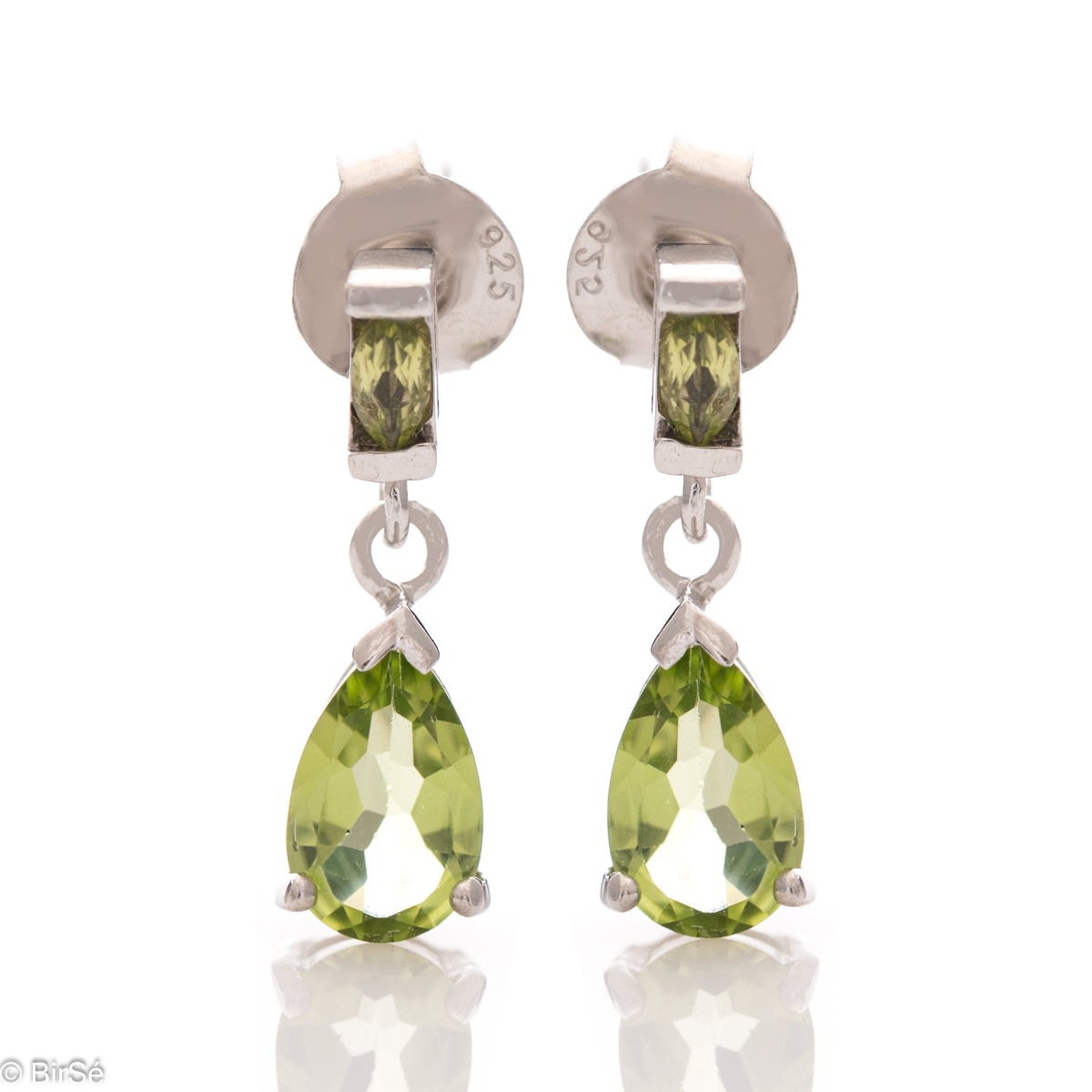 Surrender to the magic of lovely women's earrings with a radiant natural peridot stone, in a beautiful teardrop shape and gentle curves of rhodium silver. The earrings are part of a charming ring and pendant set.