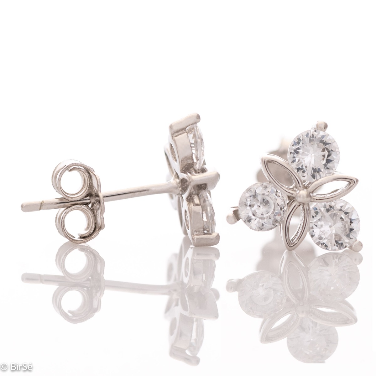 Delicate women's earrings made of fine rhodium silver, with an interesting design layout of a charming flower. Beautiful petals, exquisitely shaped by glittering zircons make this jewelry a desirable gift for any lady. And the pin fastening is a convenien