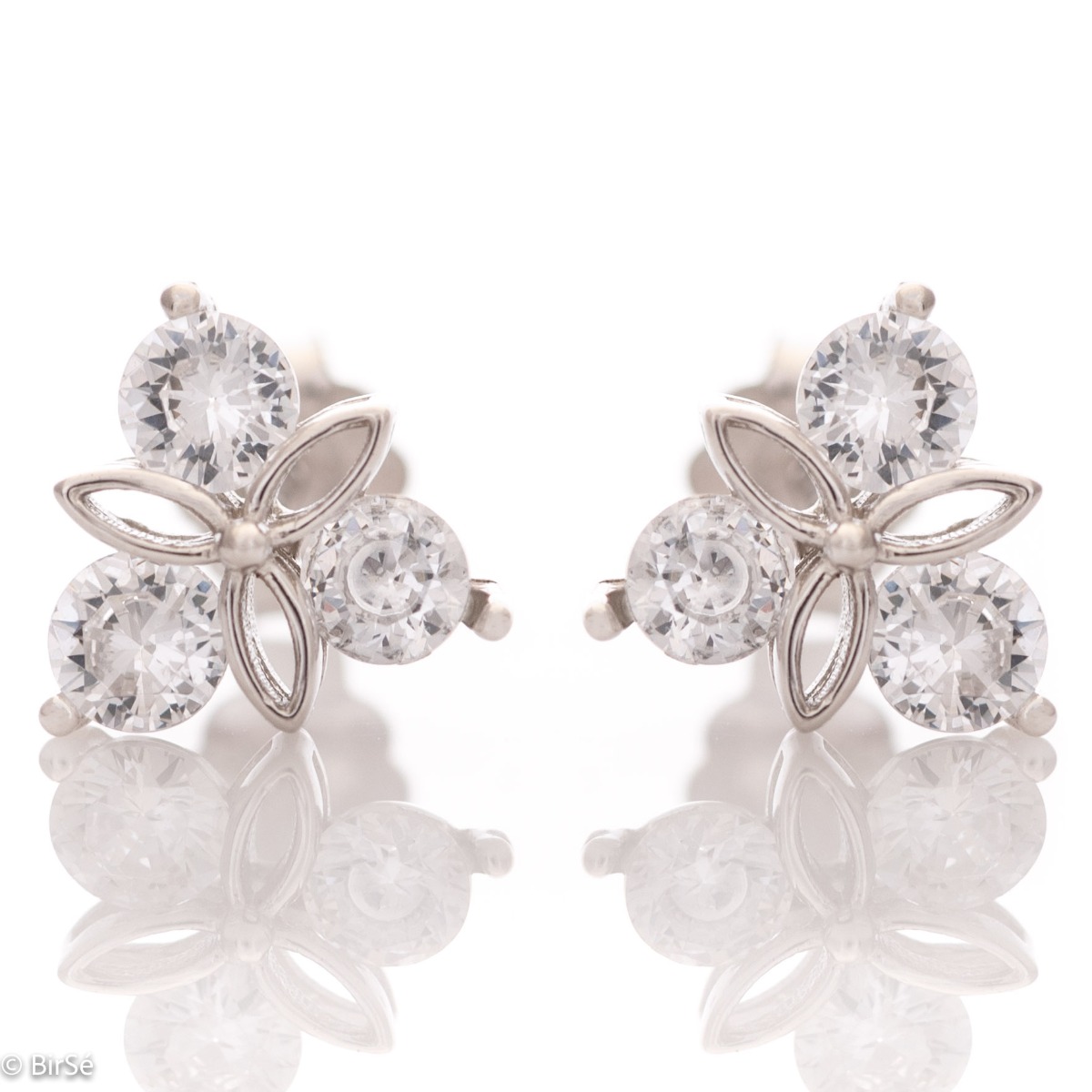 Delicate women's earrings made of fine rhodium silver, with an interesting design layout of a charming flower. Beautiful petals, exquisitely shaped by glittering zircons make this jewelry a desirable gift for any lady. And the pin fastening is a convenien