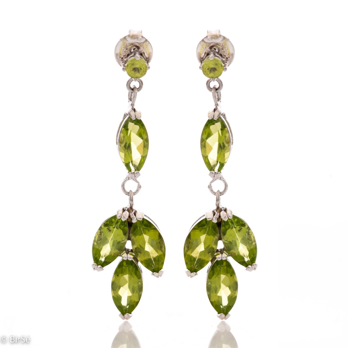 Beautiful rhodium-plated sterling silver and soft green peridot earrings. Charming jewelry for ladies with lovely green eyes.