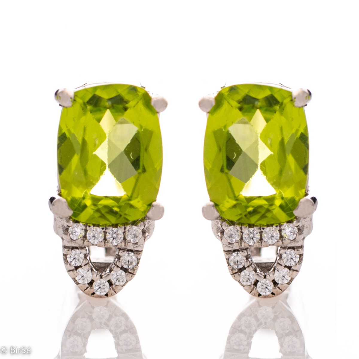 For the gallant ladies with elegant taste and style, our rhodium silver and natural peridot earrings will complement any outfit perfectly. You can match them with a ring from the same collection.