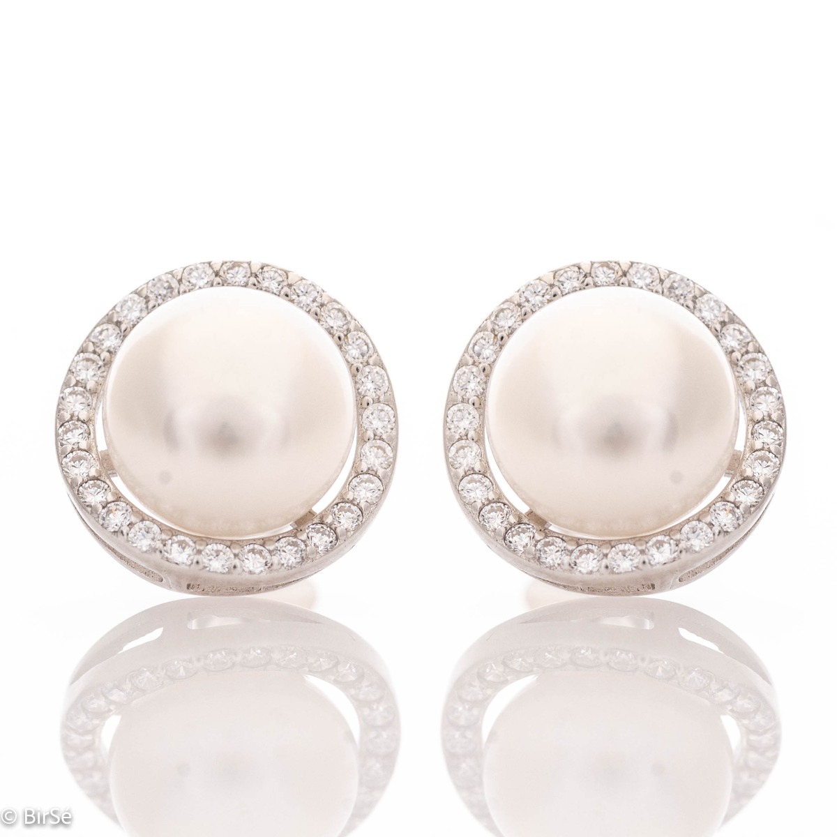 Stylish women's earrings, exquisitely crafted from fine rhodium silver. A captivating natural pearl is at the base of the earrings, charmingly surrounded by sparkling zircons. A suitable piece of jewelry for your special moments.