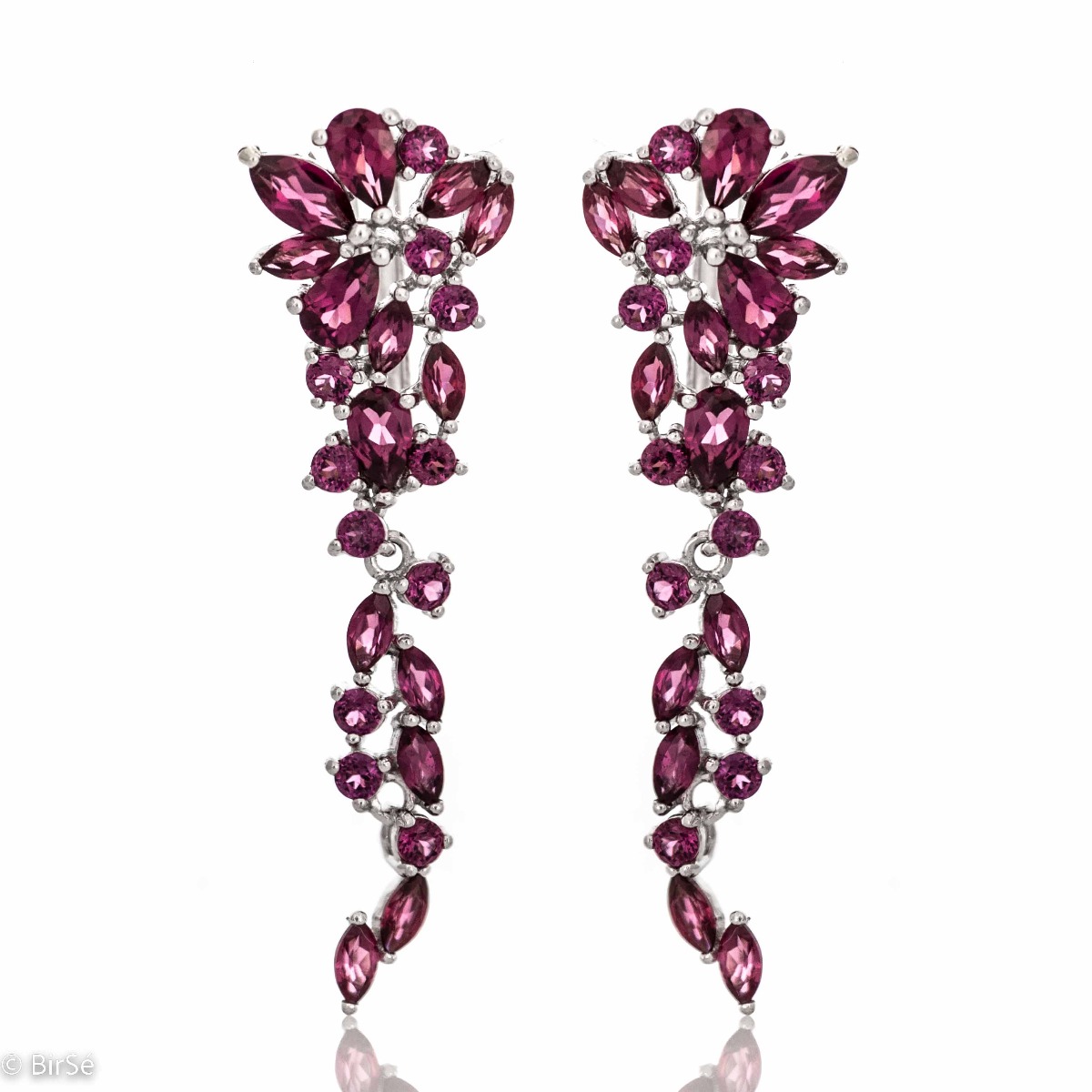 In these royally elegant rhodium silver earrings, captivating rhodolite stones gently intertwine with silver.