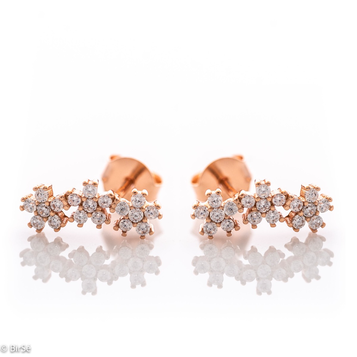 Delicate silver stud earrings with exquisite workmanship entirely in rhodium-plated rose silver. Three small glittering zirconia flowers fascinate with their beauty and style.