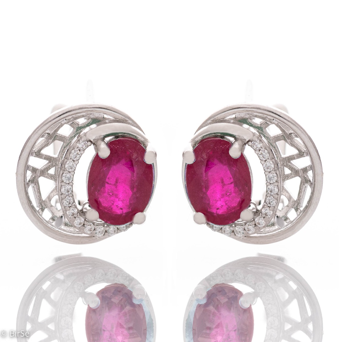 Elegant silver earrings with a modern look and English clasp. Stylish designer craftsmanship from a fine combination of rhodium-plated silver with captivating natural rubies. Complete with silver pendant and silver ring from the same collection.