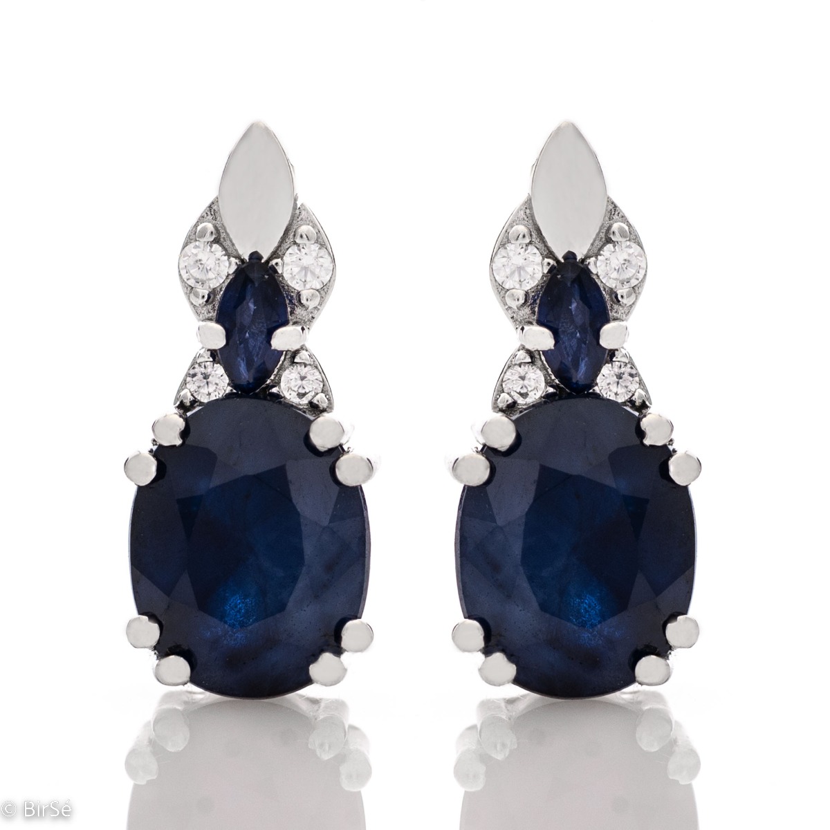 Add style to your look with the elegant design of rhodium silver earrings with natural sapphire. They suit any face type, hair color and you can match them with a ring and pendant from the same collection.