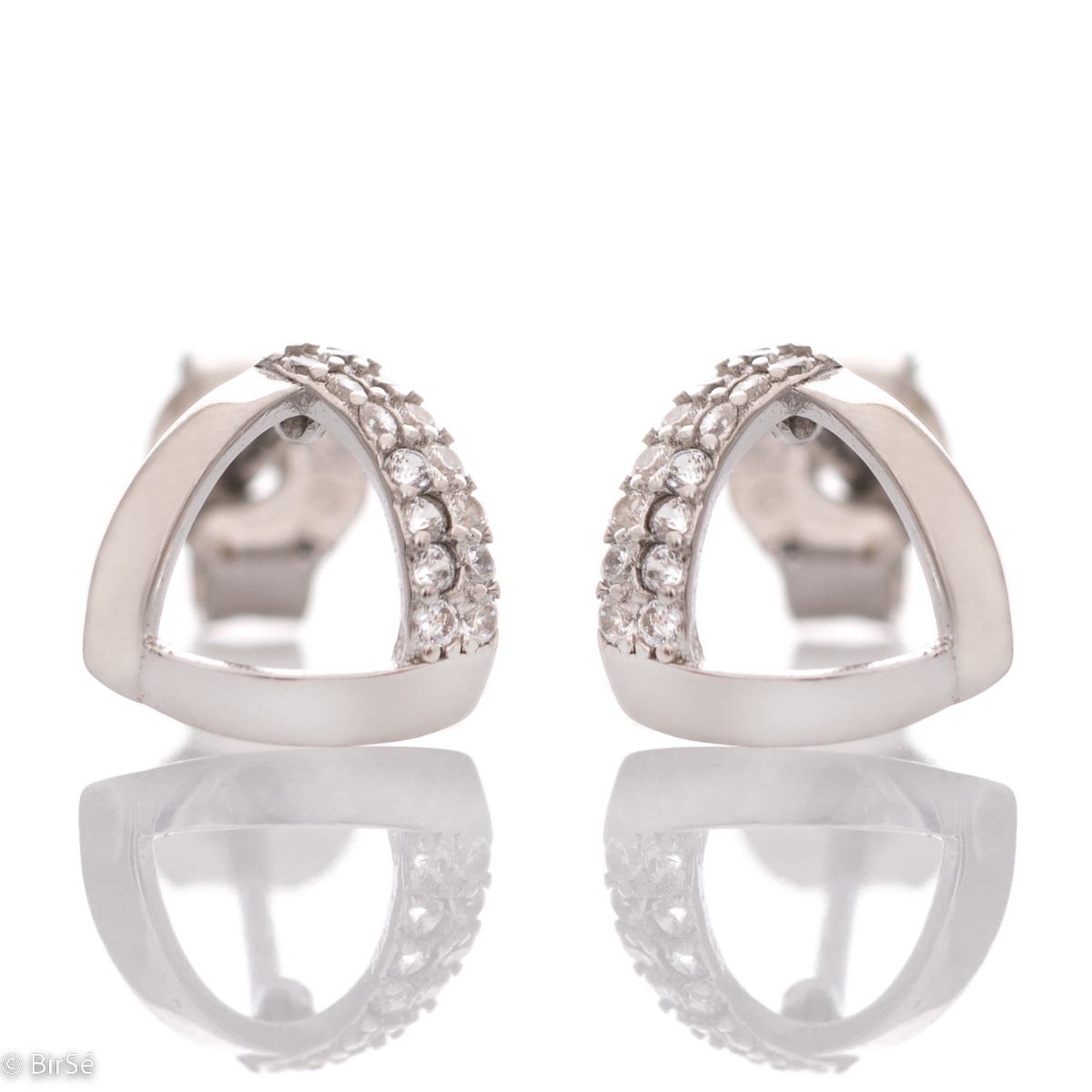 Charming earrings with a delicate design, made of rhodium-plated silver, combined with fine sparkling zircons. The pin fastening is secure and comfortable, and the earrings make a suitable gift for any lady.