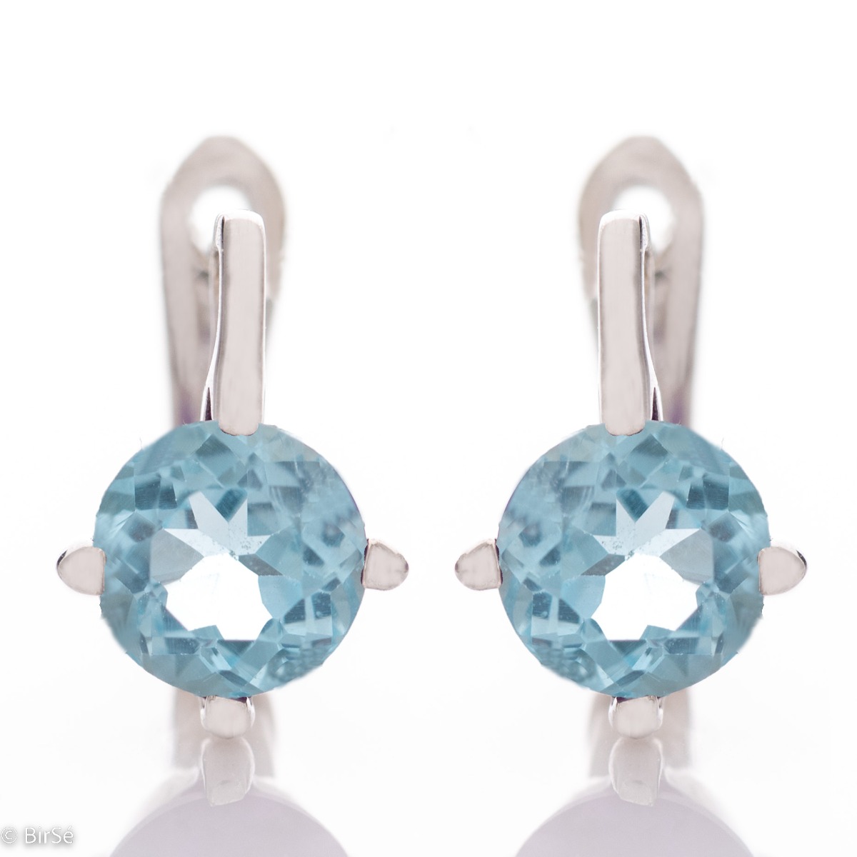 The soft blue glow of a natural blue topaz stone, complemented by the sparkle of rhodium silver - our new ladies' English clasp earrings with exquisite craftsmanship. In an exclusive ring and pendant set.