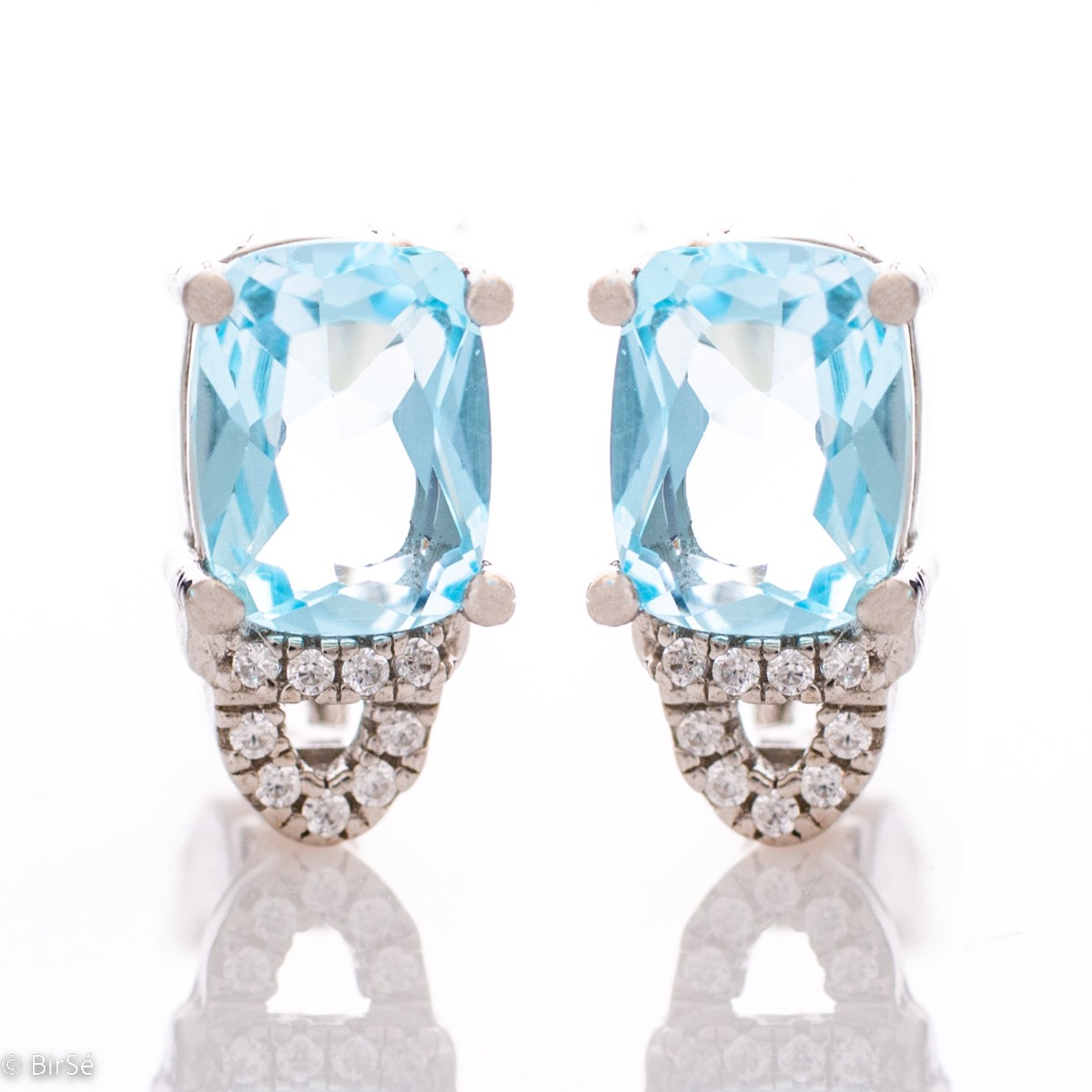 For the gallant ladies with elegant taste and style, our rhodium silver and natural blue topaz earrings will complement any outfit perfectly. You can match them with a ring from the same collection.