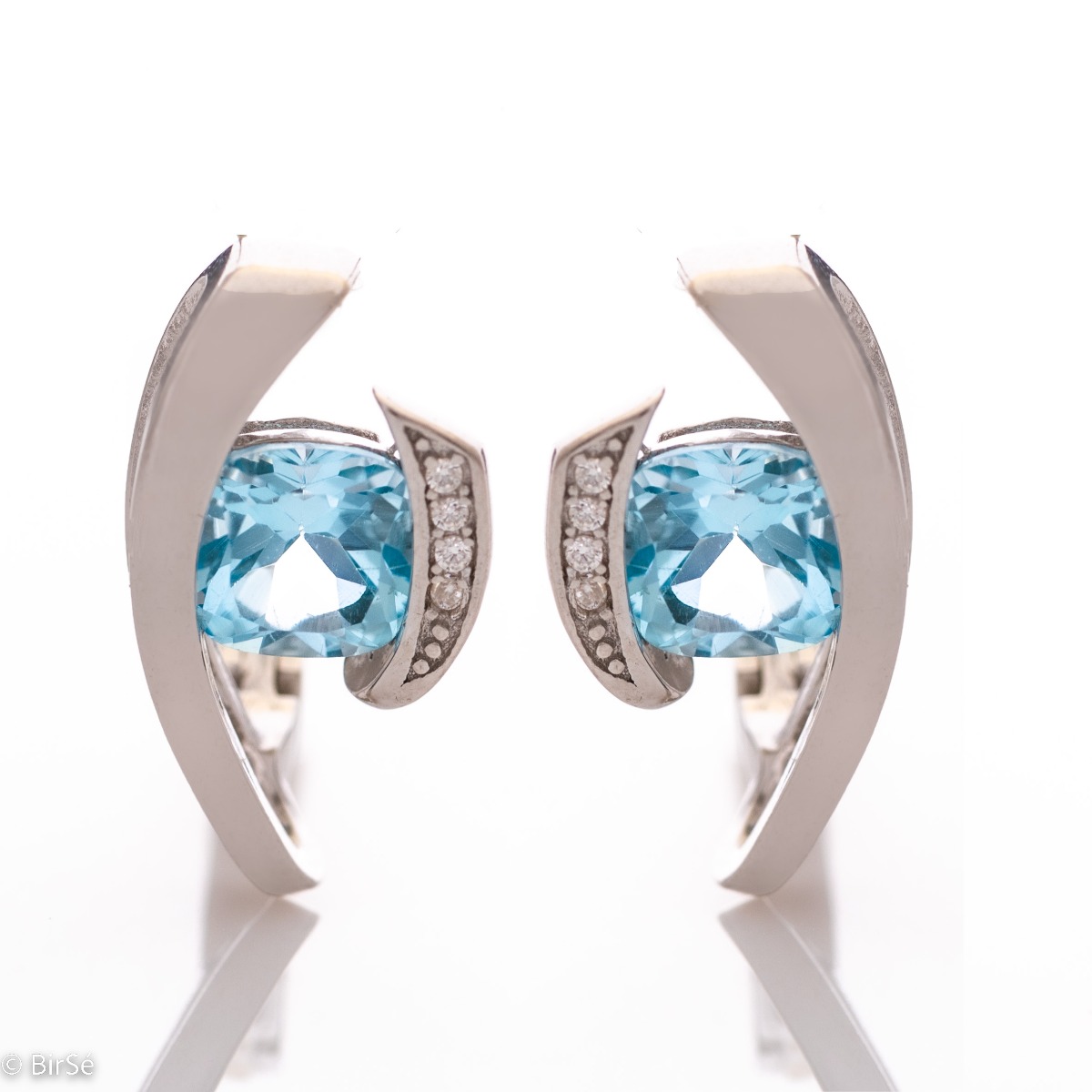 Add a subtle glow with the rhodium silver and natural blue topaz earrings. We have also selected a ring from the same collection for the beautiful pair with an English clasp.