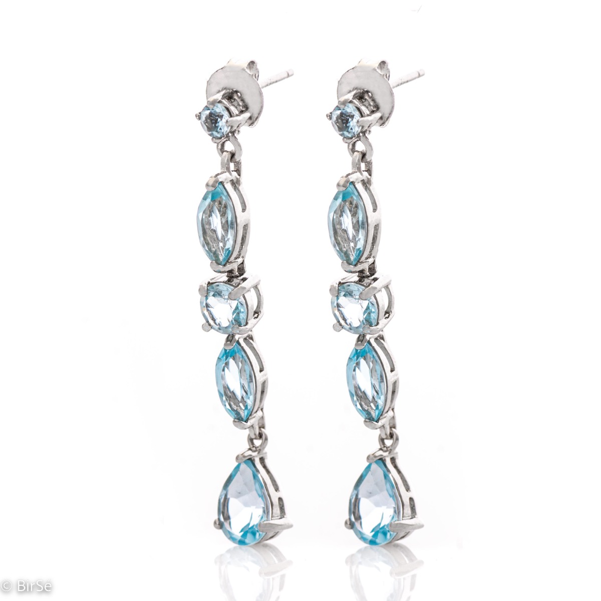 Exquisite earrings that will add sparkle to any look! Irresistible dangle earrings are made of soft rhodium silver and sparkling natural topaz, in a sky blue color.