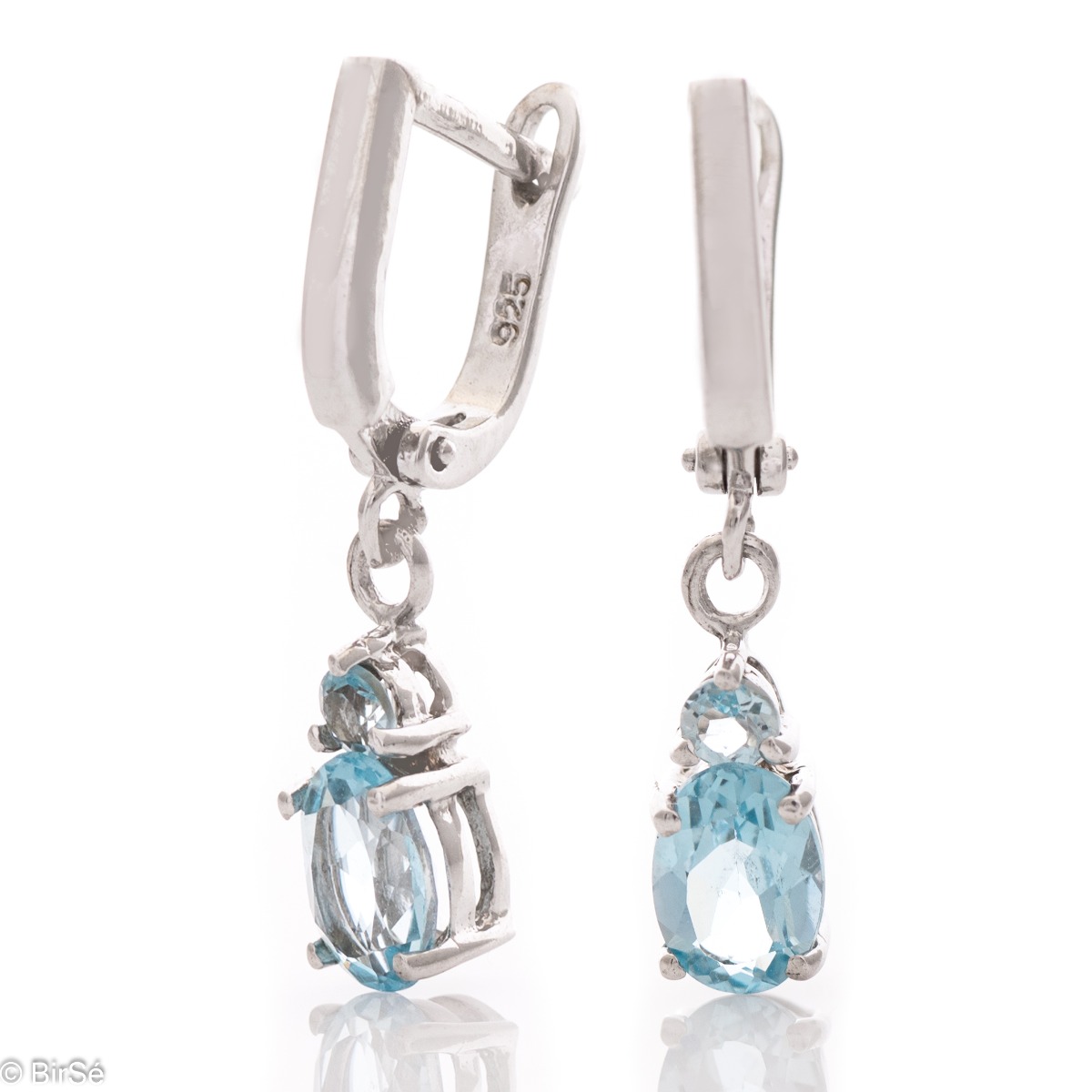 Elegant rhodium silver dangle earrings for every style - these are our earrings with a captivatingly delicate blue topaz. Elegance yourself or a loved one with the complete set, which includes a ring and pendant with the same lovely design.