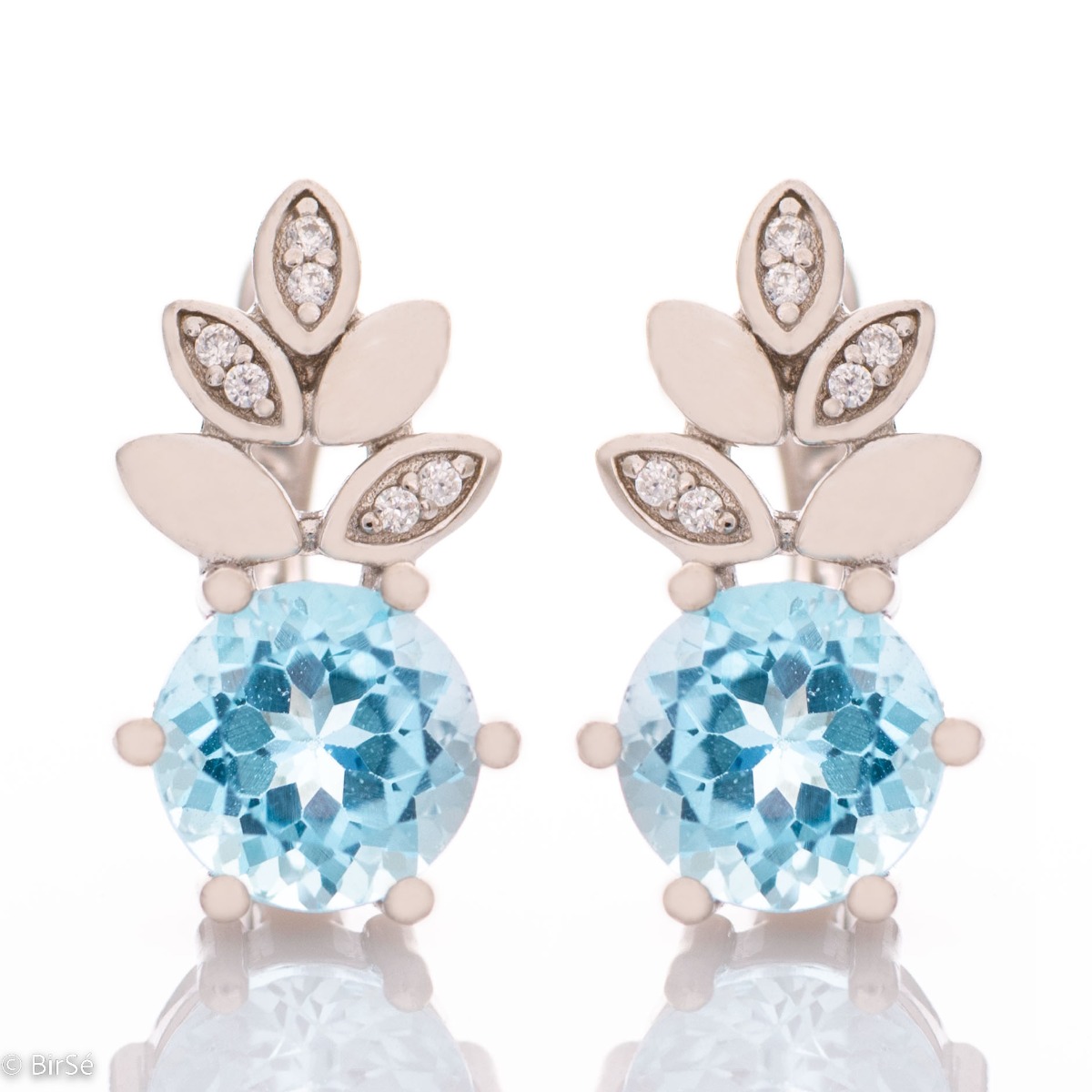 Charming earrings with exquisite design in pineapple shape carefully crafted from rhodium silver, sparkling blue topaz and fine cubic zirconias. Part of a delightful set that includes a ring and delicate pendant with the same lovely design. The effect of 