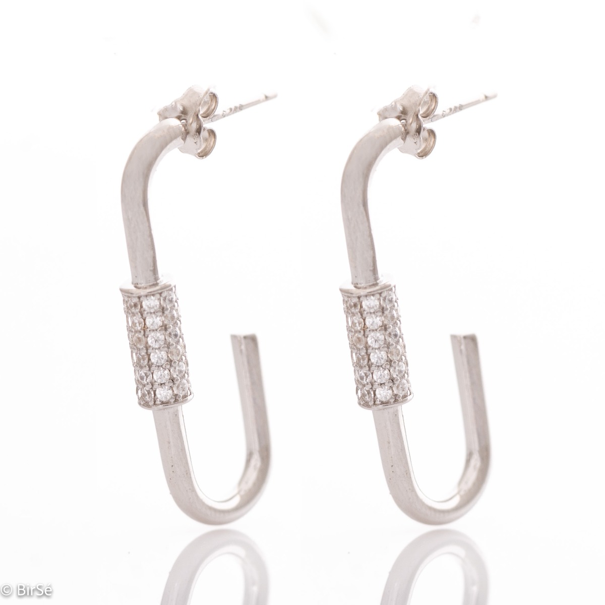 Extravagant earrings in fine rhodium silver with a modern design, decorated with an element of sparkling zircons. Pin fastening is for convenience and security.