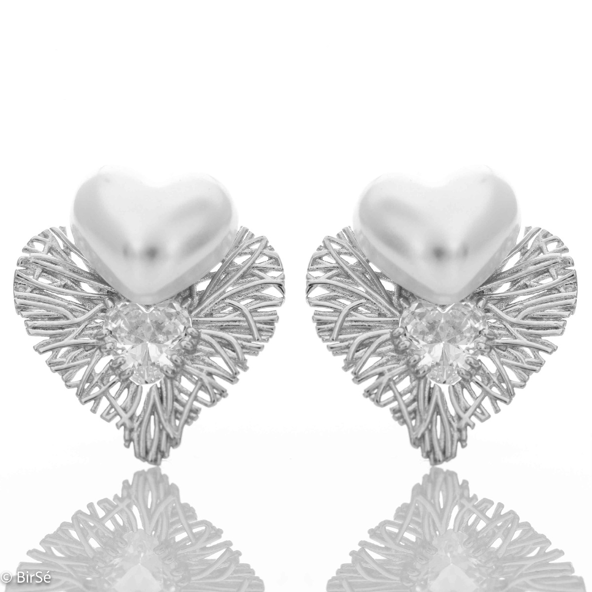 Longing and dreaming of love expressed in the new BirSe earrings. Crafted from fine rhodium silver, an openwork heart gently wraps around a smaller pearl heart and added cubic zirconias for added sparkle. The jewelry is a beautiful gift for the beloved wo