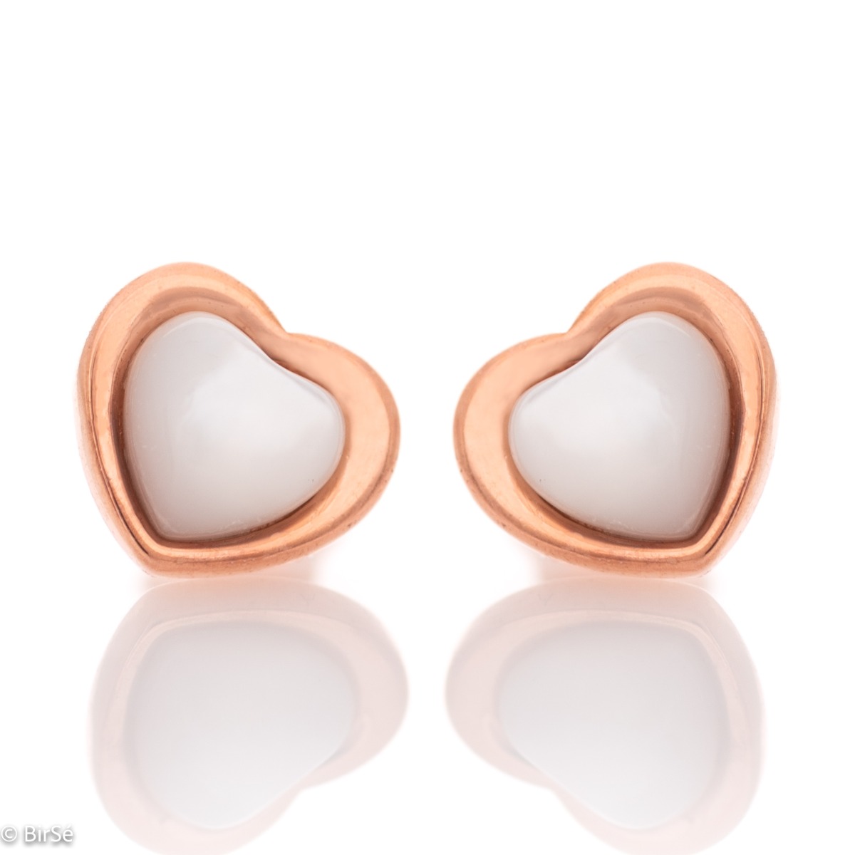 Elegant ladies' earrings made entirely of fine rose silver with a heart shape. Their core is shaped from a beautiful milky white stone, and the fastening is with a pin.