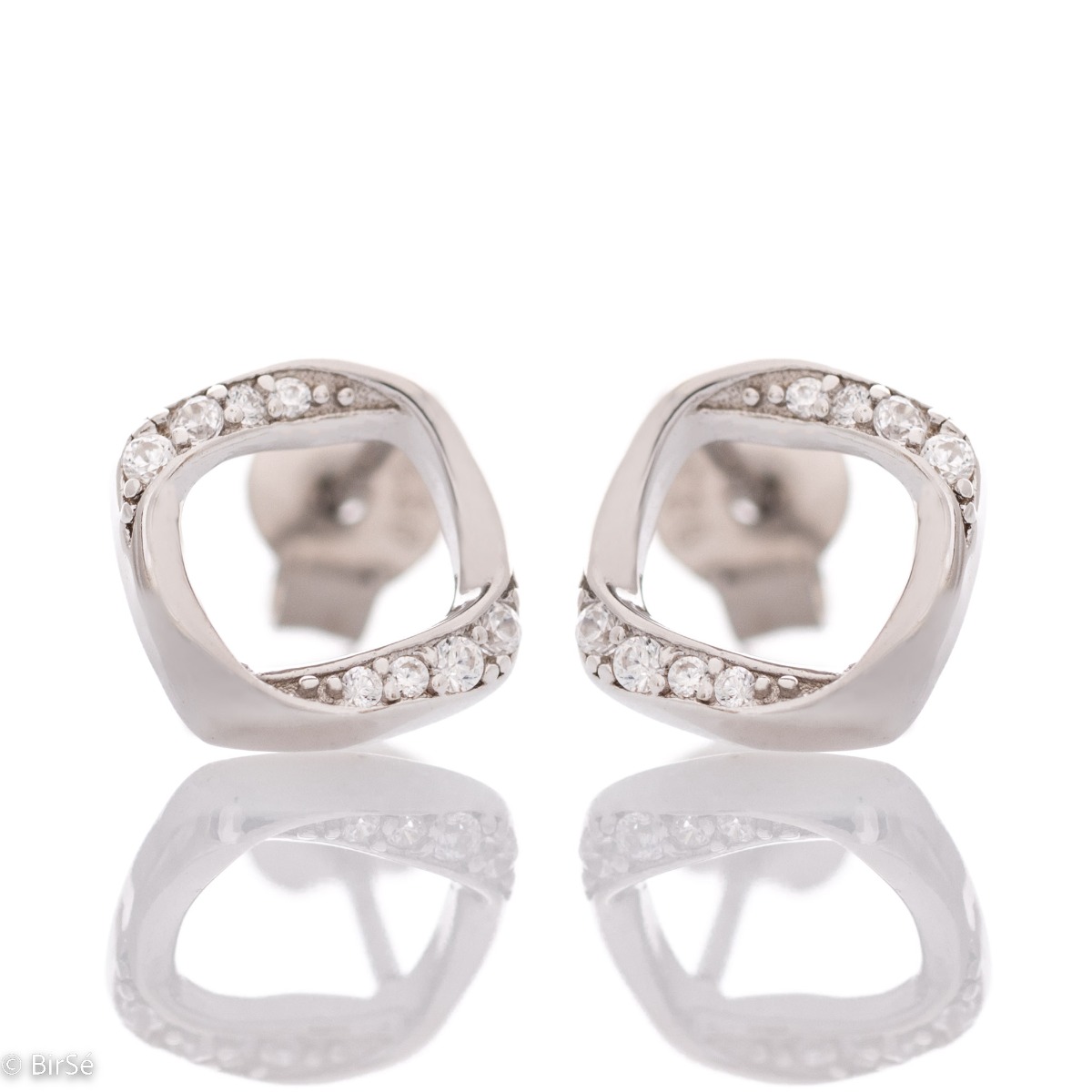 Charming earrings with a delicate design, made of rhodium-plated silver, combined with fine sparkling zircons. The pin fastening is secure and comfortable, and the earrings make a suitable gift for any lady.