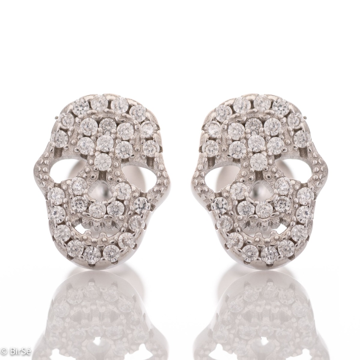 Eccentric women's earrings in fine rhodium silver, with an interesting skull design, covered with zircons. Earrings are a suitable gift for women who admire the unconventional style in jewelry.