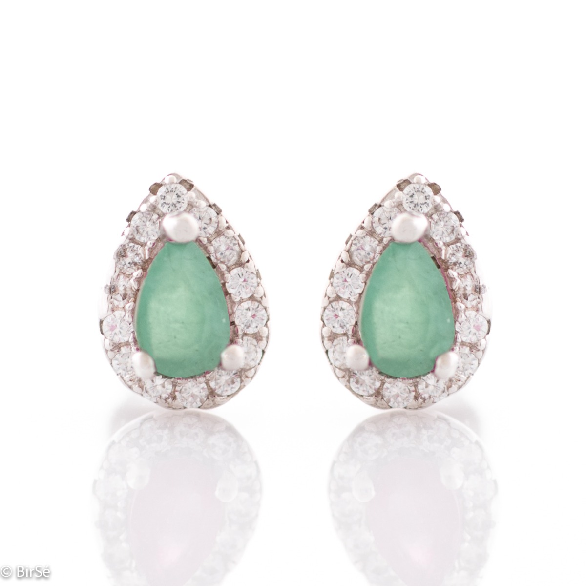 Radiant stud earrings delicately crafted in teardrop shape and fine rhodium silver, complemented by exquisite natural emerald and sparkling zircons.