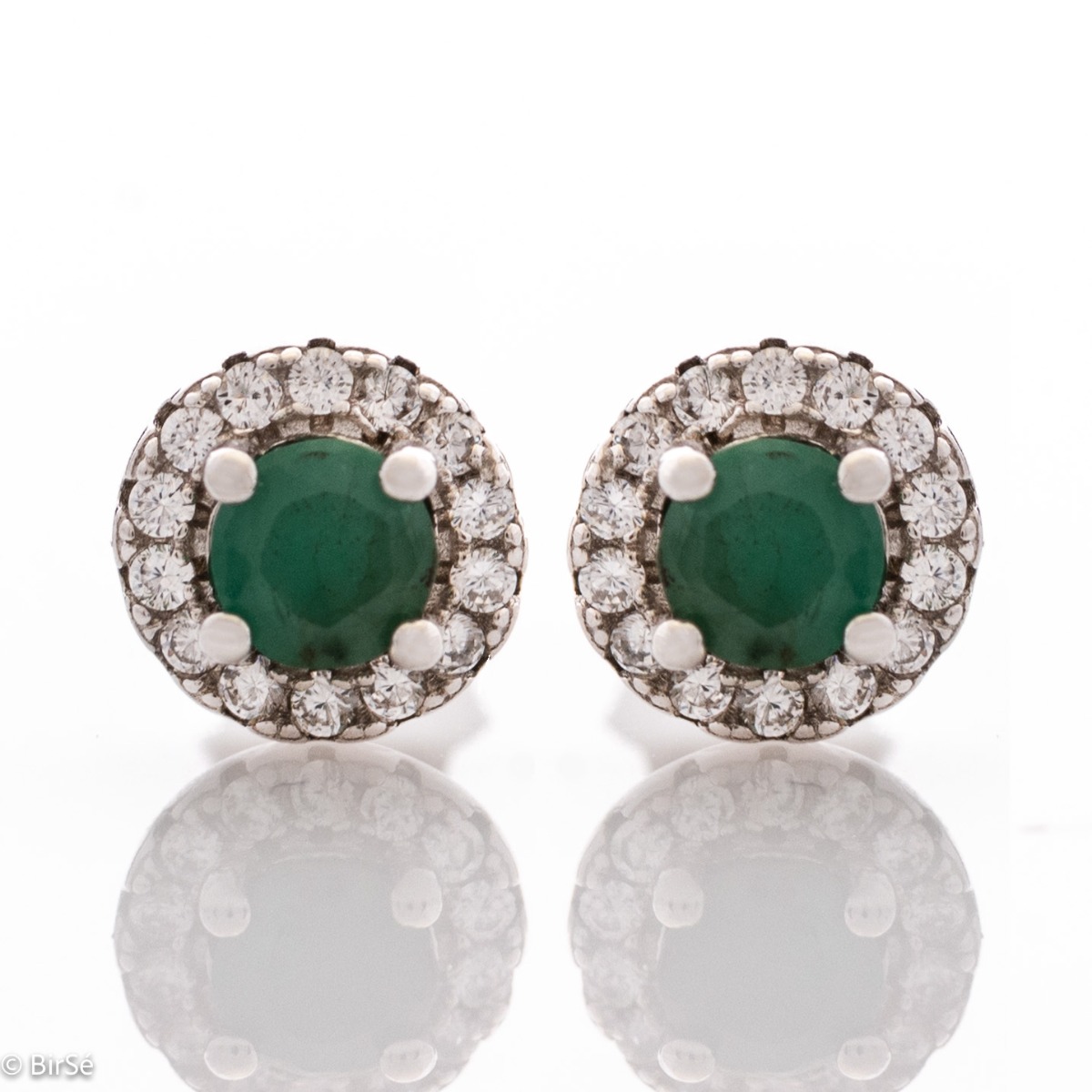 Exquisite beauty - stunning sterling silver earrings with a delicate look and pin fastening. An elegant composition made of a fine combination of rhodium-plated silver with an exquisite emerald and dazzling zircons.