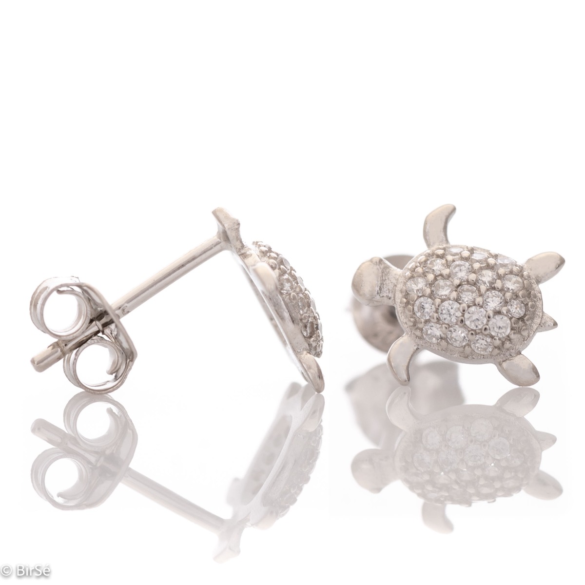 Delicate women's earrings in fine rhodium silver, with designer shaped turtles studded with sparkling zircons. The earrings are fastened with a pin - extremely convenient and secure. A suitable gift for any lady, being a symbol of constancy and wisdom.