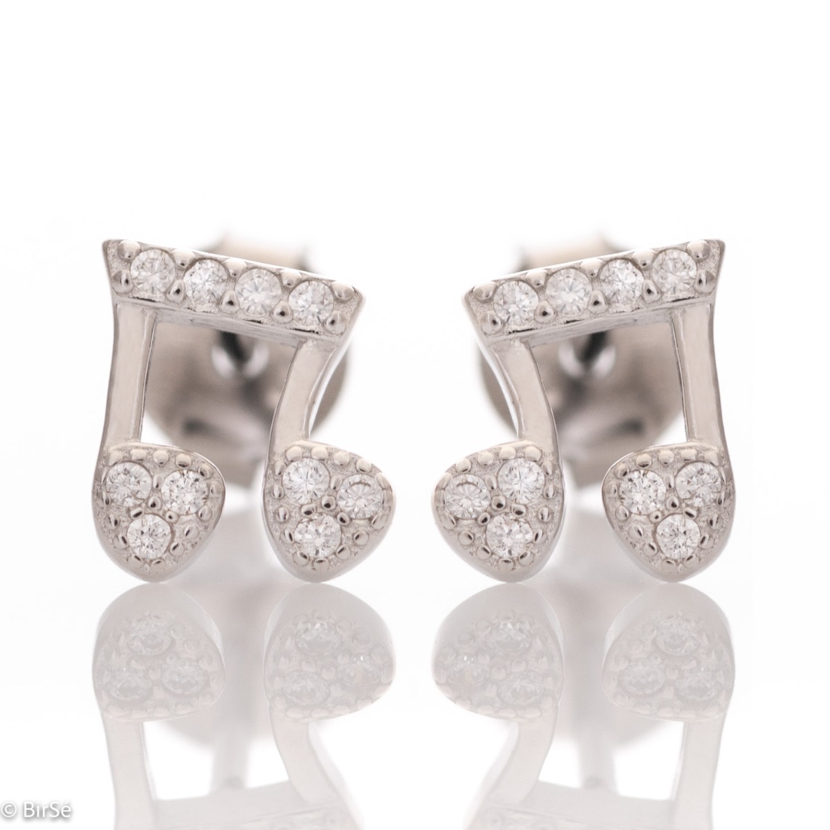 Delicate women's earrings made of fine rhodium silver, with an interesting design layout in a musical style. Beautiful notes, exquisitely decorated with glittering zircons, would make a suitable gift for any lady devoted to music. And the pin fastening is