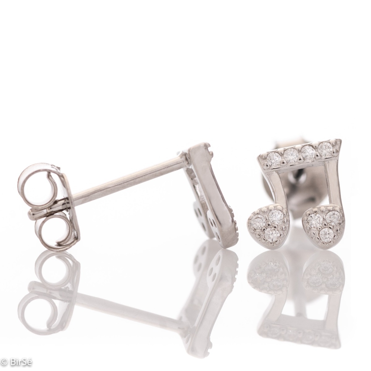 Delicate women's earrings made of fine rhodium silver, with an interesting design layout in a musical style. Beautiful notes, exquisitely decorated with glittering zircons, would make a suitable gift for any lady devoted to music. And the pin fastening is