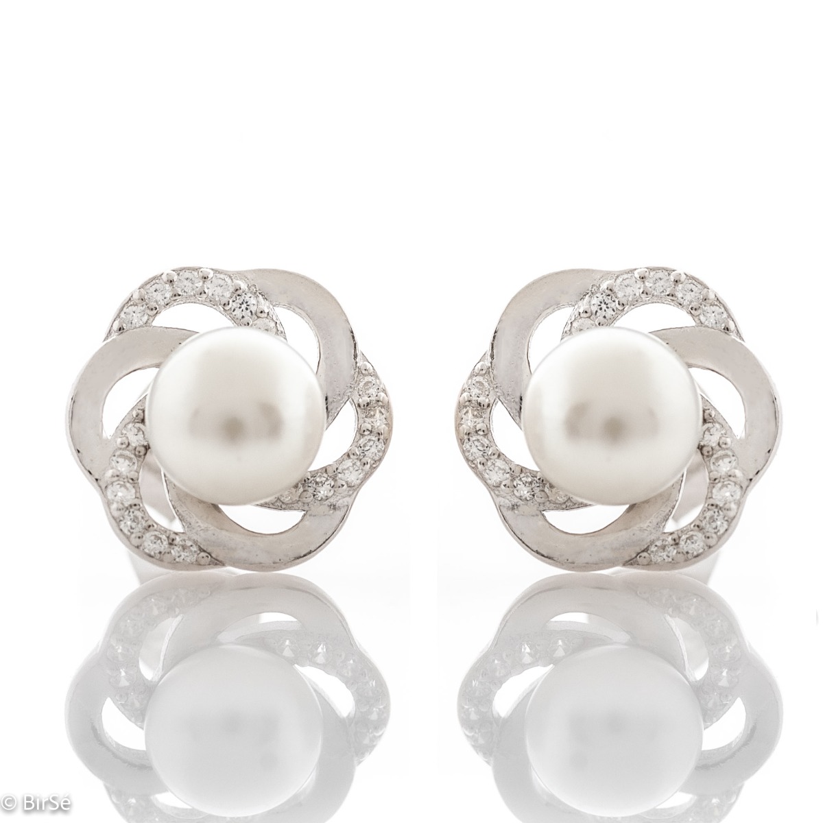 A beautiful model of women's earrings, entirely made of fine rhodium silver, with a comfortable and secure pin fastening. Delicate, sparkling zircons adorn the elements, stylishly surrounding an exquisite pearl. Charming and suitable for any occasion.