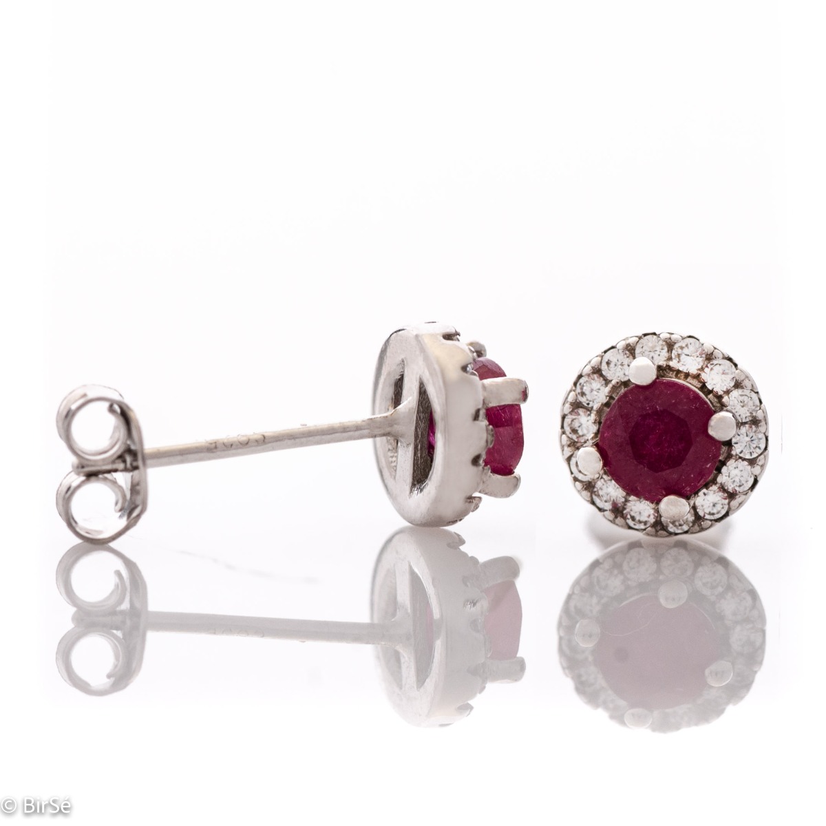 Royal beauty in stunning sterling silver earrings with delicate look and pin fastening. An elegant composition made of a fine combination of rhodium-plated silver with an exquisite ruby ​​and dazzling zircons.